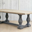 Perspective view of the Parkhouse Double Pedestal Dining Table, illustrating its rustic elegance.