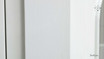 Close-Up of White Paint Finish - A detailed view of the Stonefield Wall Unit’s white paint-stroke patina, showcasing the hand-finished and subtly distressed surface that adds a layer of texture and depth to its classic design.