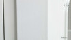 Close-Up of White Paint Finish - A detailed view of the Stonefield Wall Unit’s white paint-stroke patina, showcasing the hand-finished and subtly distressed surface that adds a layer of texture and depth to its classic design.