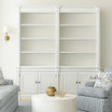Front view of the Stonefield Double Bookcase Wall Unit in situ in a Modern Classic living room