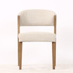 Front view of the Stanton Dining Chair in fabric with natural timber legs, showcasing its contemporary design and refined Hamptons style aesthetic.