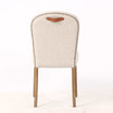 Rear view of the Stratford Dining Chair displaying its tailored textured weave back, brass stud trim and signature top grain leather pull handle, ideal for modern Hamptons dining interiors.