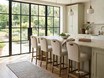 High-end upholstered kitchen island seating for modern farmhouse and coastal interiors by Thomas and Hurley