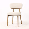 Three quarter front view of the Royston Dining Chair featuring premium textured upholstery and tapered timber legs for refined dining spaces.