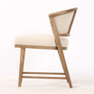 Minimalist side view of the Thomas and Hurley Windsor Dining Chair emphasising its sculptural timber frame, refined proportions and premium weave textured upholstered seat for welcoming and sophisticated dining.