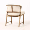 Three quarter rear view of the Windsor Dining Chair displaying the curved timber back rail and frame construction, combining architectural form with designer craftsmanship