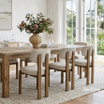 Stuttgart Dining Chair styled in a light-filled dining room with natural timber table and upholstered seating