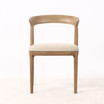 Laguna Dining Chair in natural timber finish, front view highlighting sculptural backrest and premium upholstered seat, a luxury contemporary dining chair for modern Hamptons interiors.