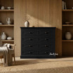 Fremont black chest of drawers by Thomas & Hurley with geometric X-panel fronts and brass handles, luxury bedroom furniture