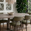Ovalis 240cm brushed oak dining table angled styled view in a modern luxury interior