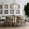 Ovalis 240cm Dining Table in brushed oak styled in a contemporary dining setting with upholstered chairs