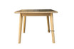 Side profile of the Lofthouse dining table in natural oak showing slim tabletop profile and tapered legs.