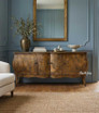 A front styled view of the Featherington Commode highlighting sculptural form,  hand-finished patina, and cabriole style legs.