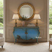 A front facing styled view of the Hyacinth Bombe Commode/Sideboard showcasing curved silhouette and hand-finished blue patina with gold accents.