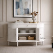 The Louis Buffet 4 Door 130cm in White by Thomas and Hurley, front view, styled and doors open, showcasing its curved design, fluted drawer detailing, and functional storage.