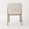 High-end linen dining chair with architectural silhouette by Thomas & Hurley in neutral upholstery with natural brushed oak timber legs