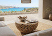 Organic modern round timber coffee table in a light filled living room