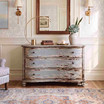 Curved serpentine three drawer bombe chest with aged blue-grey painted finish