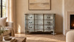 Transitional living room featuring the Finch 3 Drawer Chest against a warm plaster wall.