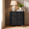 Brynmore 3 Drawer Bedside Table Petite in black with framed drawers in a styled living space with lamp and wainscoting