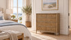 Hamptons style marble top drawer chest with elegant reeded detailing styled in a luxurious coastal bedroom with natural light and artwork