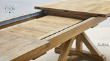 Detailed close-up highlighting the precision of the extension joints on the Harrington Table and how the extension leaves store withing the table