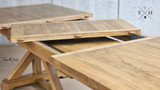Side view focusing on the extension mechanism of the table fully extended to 310cm