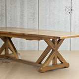 The edge angled finish of the table highlighting its x-base design