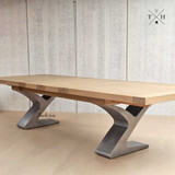Quinn's innovative table design, with a metal base, effortlessly accommodates diverse dining setups.