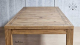 "Side view of the table surface, showing the oak’s texture and finish