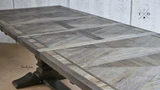 Close-up of the table’s edge finish and parquetry detail