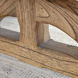 Angle view of the Trailbridge coffee table, showcasing the unique design of the bridge-style legs and the table's robust construction