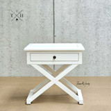 Full frontal view of the Hampstead Cross Leg Bedside/Side Table, showcasing its clean lines and crisp white finish