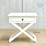 Frontal view focusing on the bedside table's crisp white satin finish