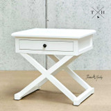 Diagonal view of the nightstand highlighting its solid construction and crisp white finish