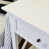 Close-up of the bedside table's top surface, highlighting the smooth satin finish and quality craftsmanship