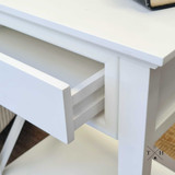 Image of the bedside table with the drawer open, showcasing the ample storage space