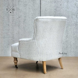 Rear Perspective of Hamptons Avery Armchair: Elegant scooped back design in blue and white stripes