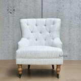 Avery Buttoned Armchair - Front Angle: Showcasing blue and white striped upholstery and classic button detailing