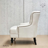 Avery Armchair Side Angle: Rolled arm and side silhouette in cream natural linen upholstery