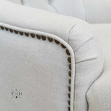 Close-Up of Avery Armchair Armrest: Rolled design with cream natural linen blend upholstery