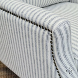 Close view of the meticulous studded detailing and Hamptons style blue and white ticking stripe