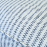 Detailed view of the Hamptons style blue and white ticking stripe linen upholstery