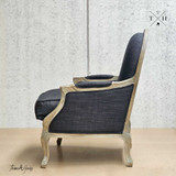 Right side view of the Montpellier Armchair in black and weathered oak