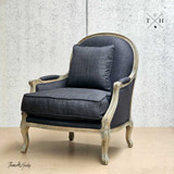 Side diagonal view of the occasional armchair highlighting the frame and design