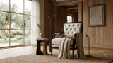 Luxury fireside chair in cream linen with classic carved timber detailing