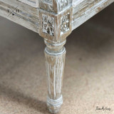 Image showing the detailed design of the weathered oak legs, adding to the chair's elegance