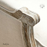 Detailed image of the chair's armrest, demonstrating the craftsmanship in the oak and linen materials.