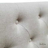 Close-up of the natural linen fabric, highlighting its texture and quality.