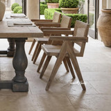Designer oak dining chair with sculpted armrests and solid timber construction by Thomas and Hurley, bringing warmth, craftsmanship, and understated elegance to modern interiors.
